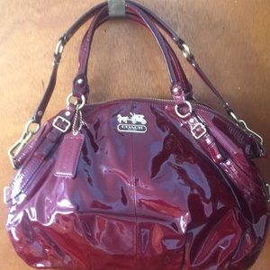 Coach - Burgundy / Red patent leather.